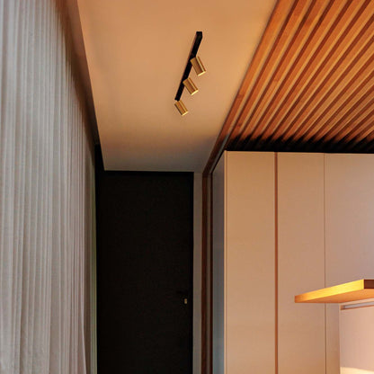 Modern interior with wooden ceiling, light fixture, and white curtains.