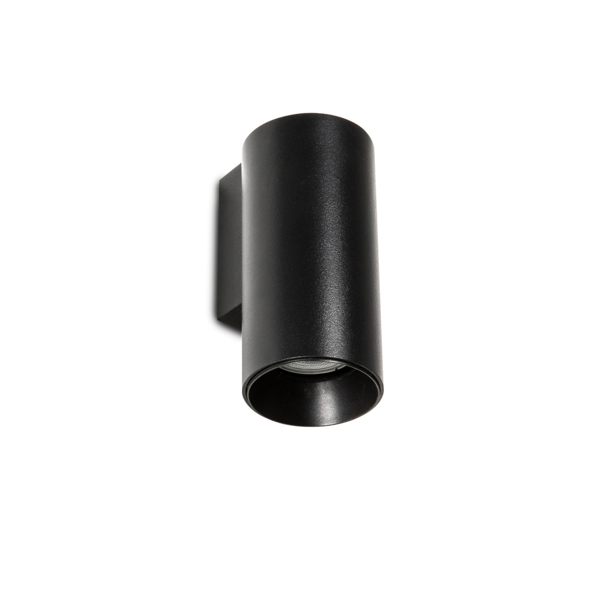 A modern matte black cylindrical wall sconce light fixture shown from an angled perspective against a solid white background.