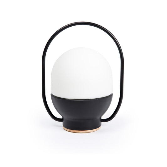 Black and white lamp with a handle on a white background