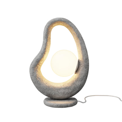 Modern table lamp with a textured gray base and white shade on a white background