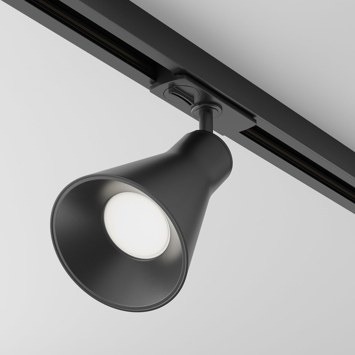 Black track light fixture on a ceiling