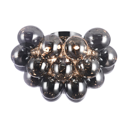 Decorative wall light fixture with glass ball design on a white background