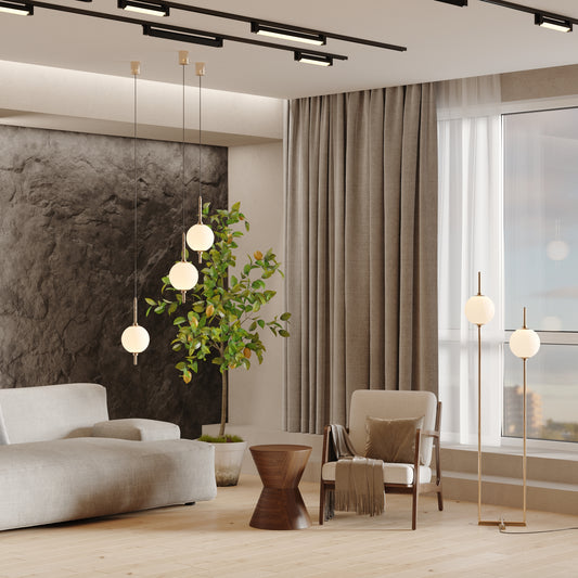 Modern living room with gray sofa, wooden coffee table, and decorative plants.