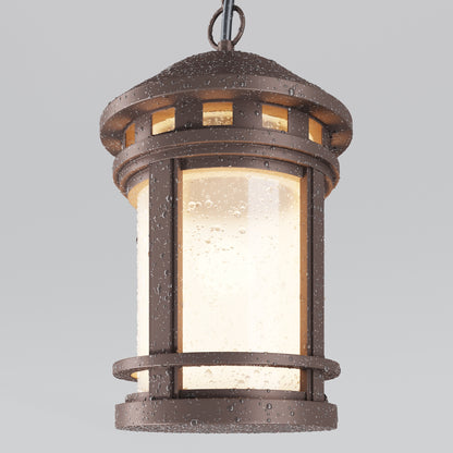 Bronze outdoor hanging lantern with a light interior on a gray background