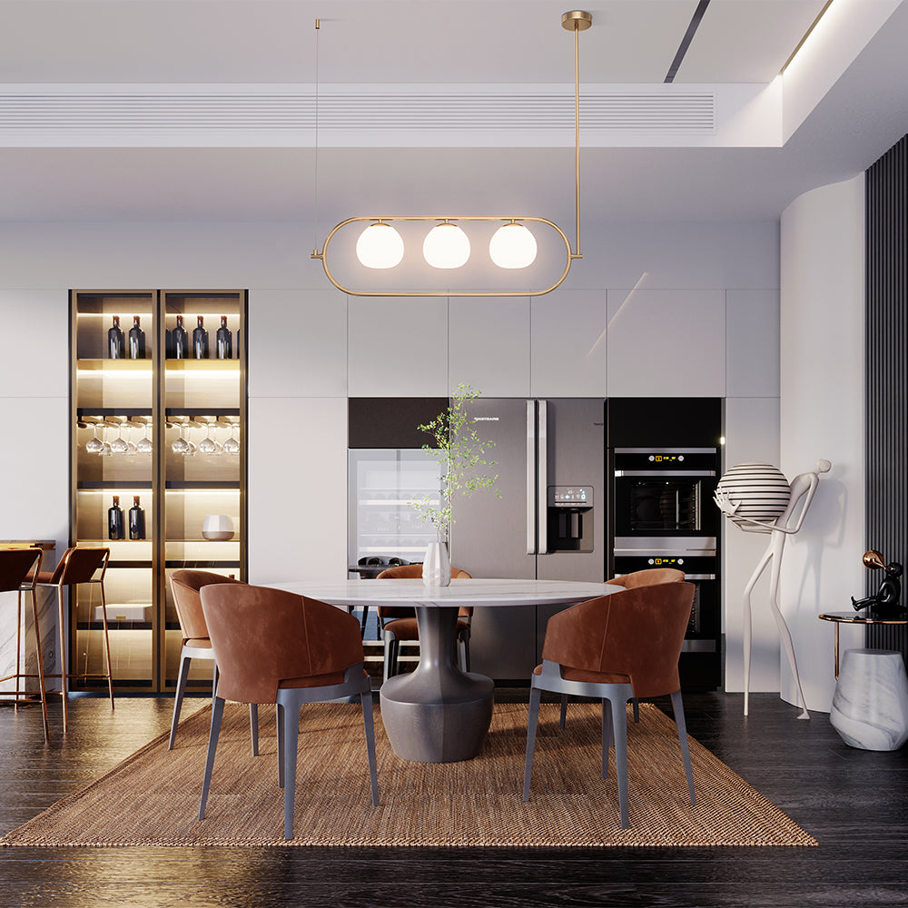 Modern kitchen with dining area featuring a table and chairs.