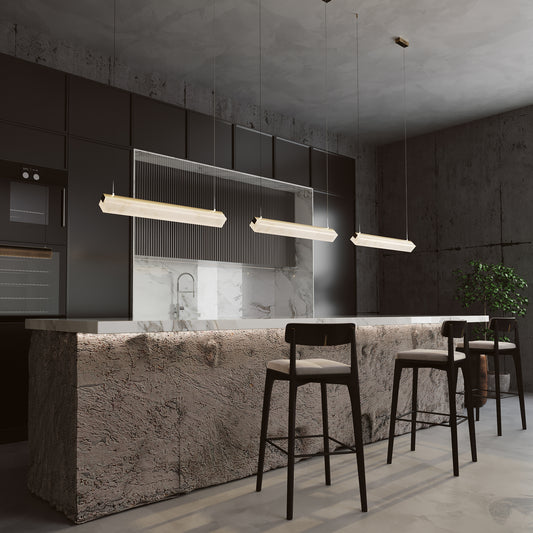Modern kitchen with marble island and bar stools, featuring a sleek design.