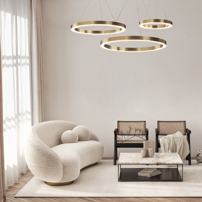 Modern living room with a white armchair, coffee table, and pendant lights.