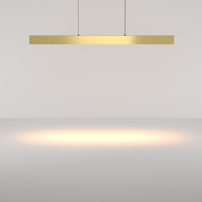 Gold pendant light fixture on a plain background