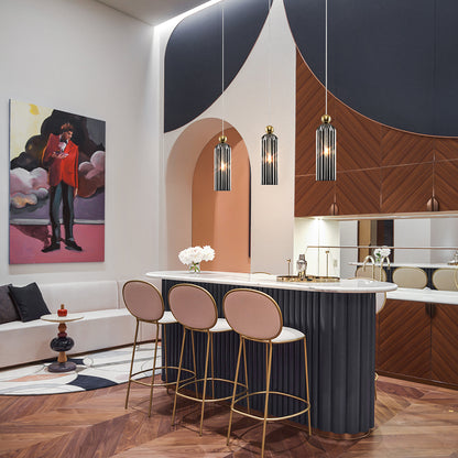 Modern kitchen with island, bar stools, and pendant lighting 