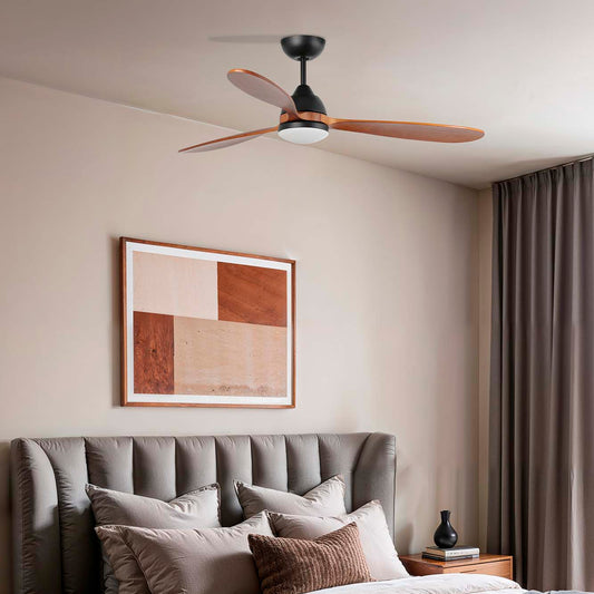 Modern bedroom with gray upholstered bed, wooden nightstands, and ceiling fan 