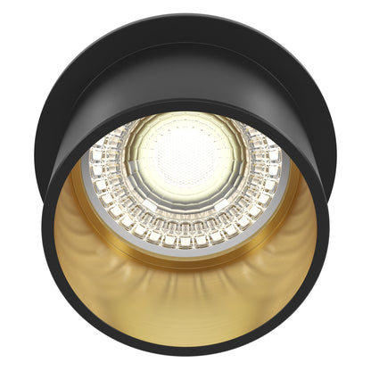 Black and gold recessed ceiling light on a white background