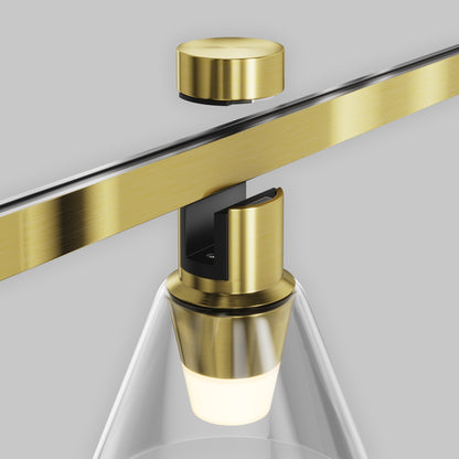 Gold-framed mirror with a light fixture on a gray background